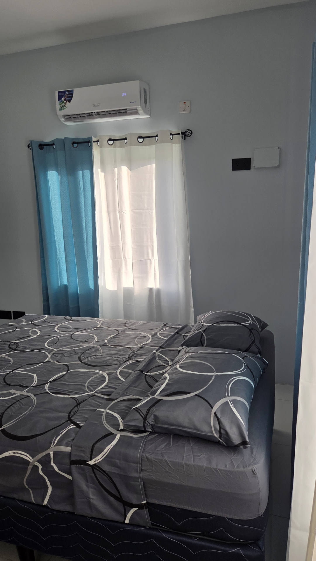 Bedroom window with split-unit air conditioning above
